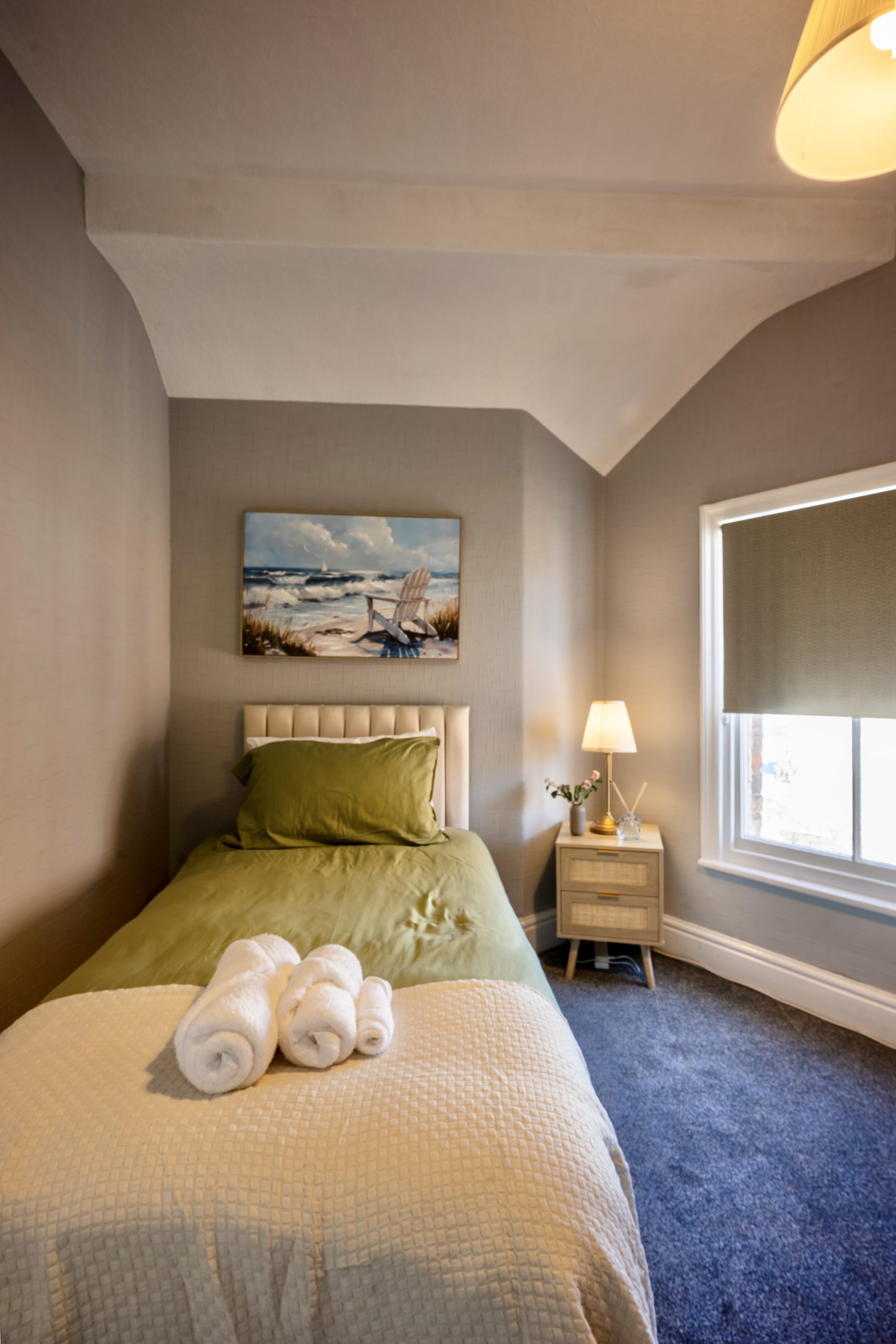 A single bed in a modern bedroom in a Southport luxury accommodation